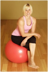 Woman sitting on exercise ball 