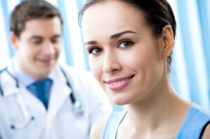Doctor and female patient Happy female patient and doctor at office