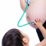 pregnant mom, kid with stethescope