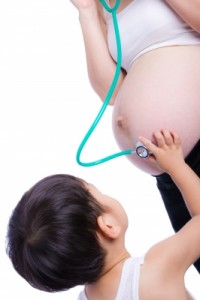 pregnant mom, kid with stethescope