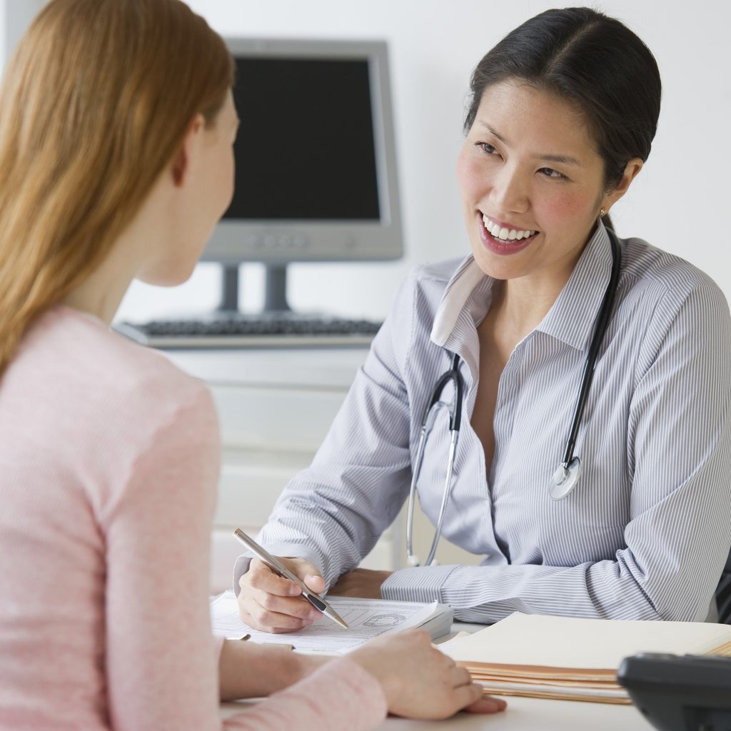 doctor listening to patient