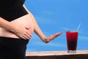 pregnant woman saying no to alcohol