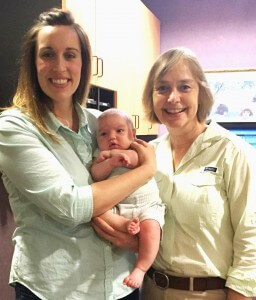 Midwife Susan Griggs with baby photo