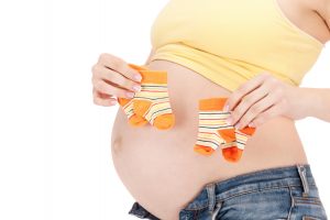 pregnant woman belly and twin socks