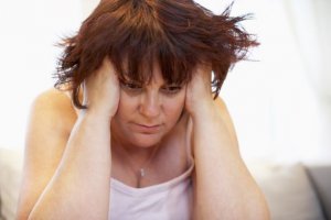 Overweight woman in pain PCOS photo