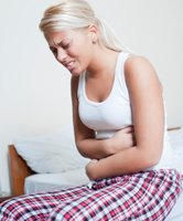endometriosis woman holding stomach pelvic pain