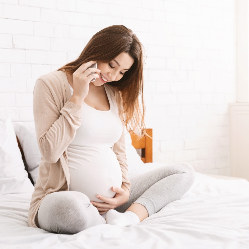 pregnant woman on phone