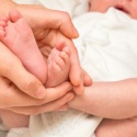 baby-with-mom-hands-and-feet_114028879