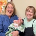 midwife and doula with baby