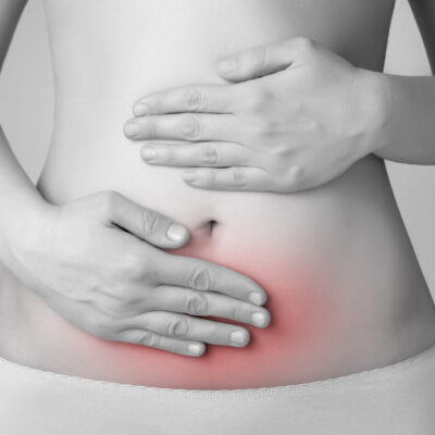 Young woman having abdominal pain